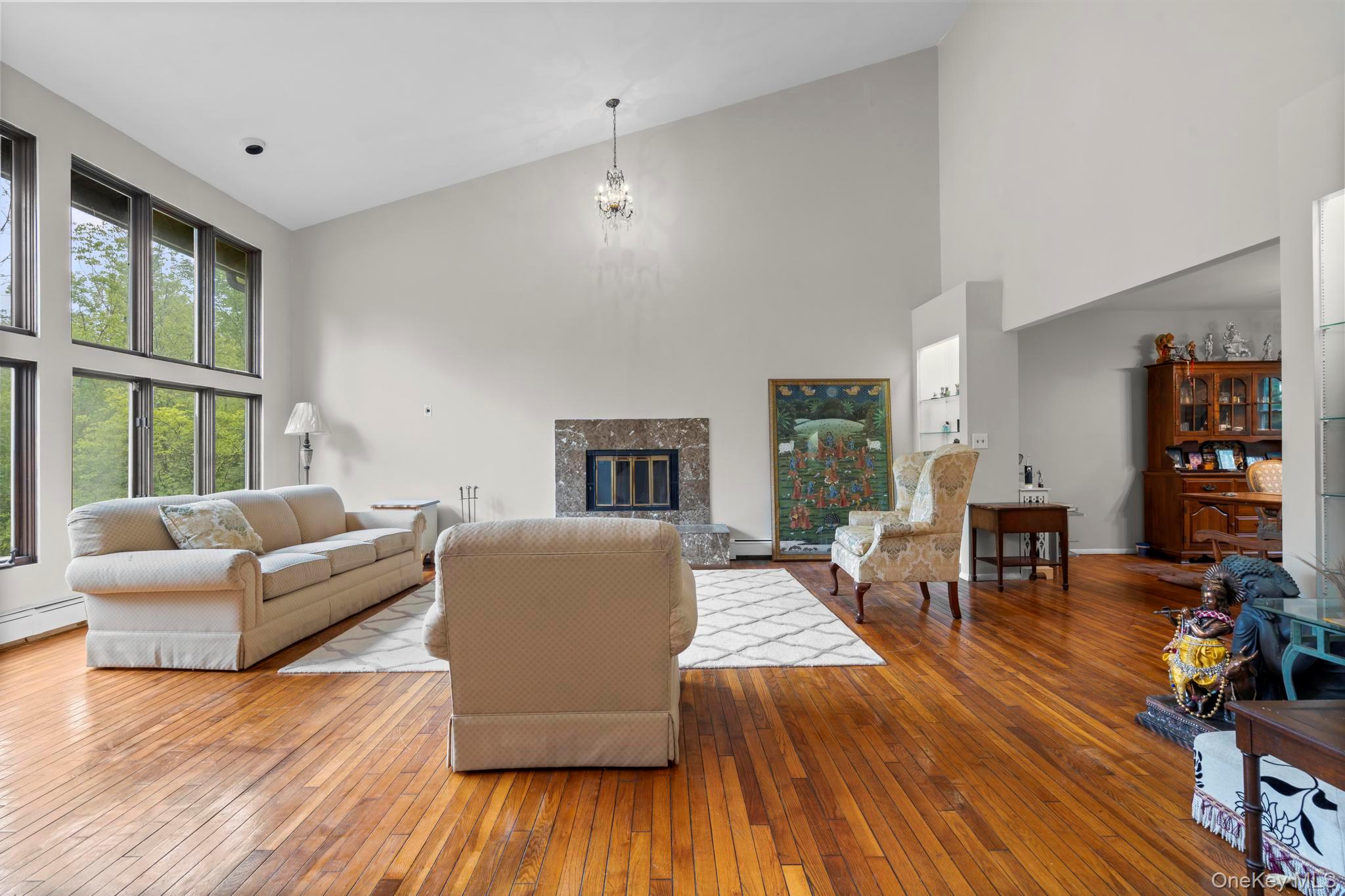 513 Bedford Road Armonk, NY 10504 - Photo 2 of 38 a living room with furniture wooden floor and a fireplace