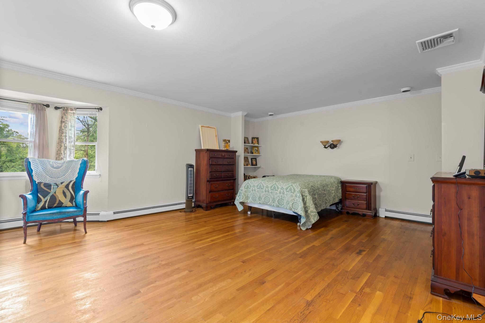 513 Bedford Road Armonk, NY 10504 - Photo 23 of 38 a bedroom with furniture and windows