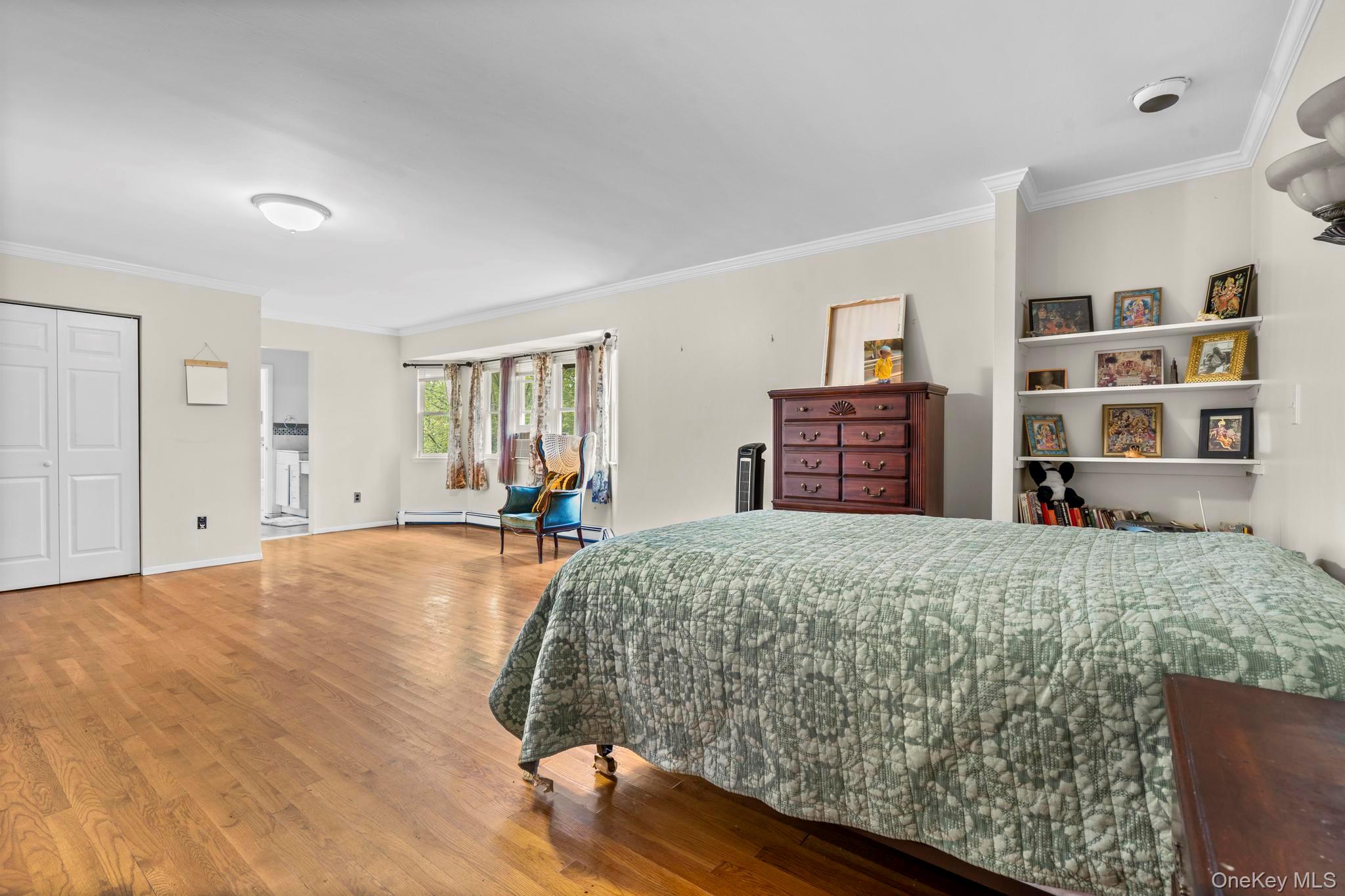 513 Bedford Road Armonk, NY 10504 - Photo 25 of 38 Bedroom with wood finished floors and ornamental molding
