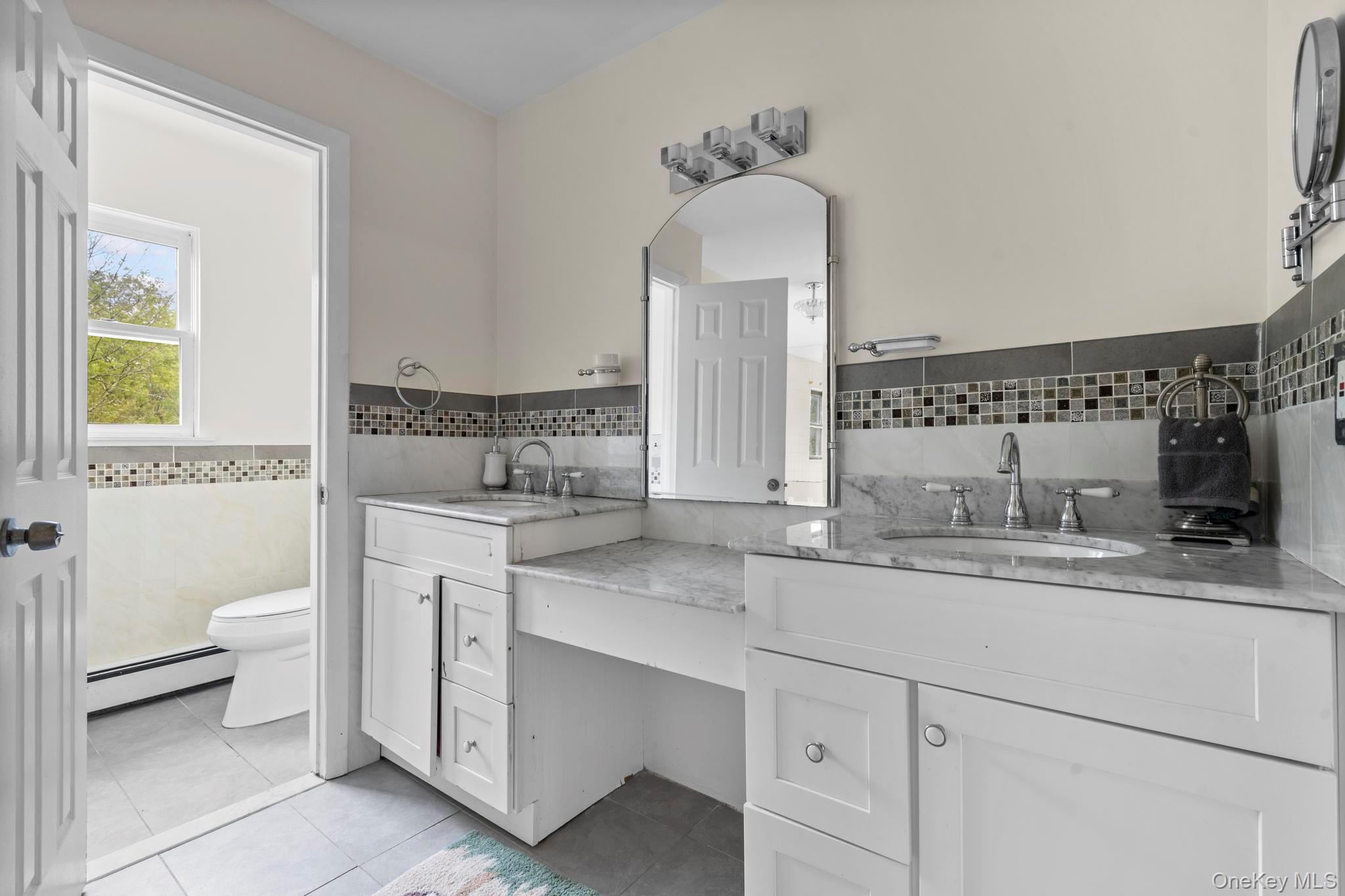 513 Bedford Road Armonk, NY 10504 - Photo 26 of 38 a bathroom with a sink and a toilet