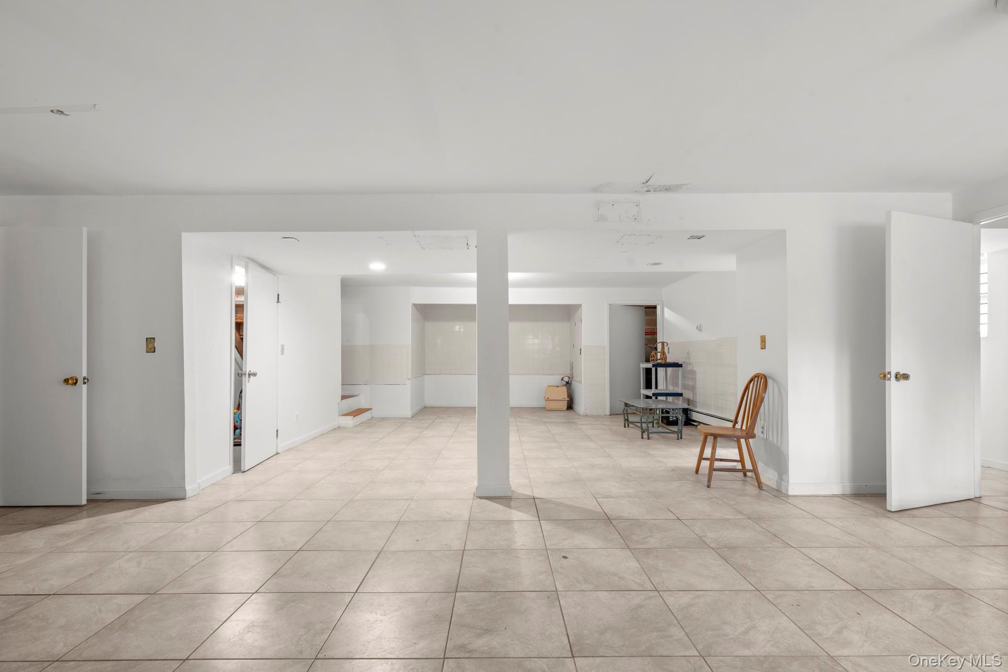 513 Bedford Road Armonk, NY 10504 - Photo 29 of 38 a view of a hallway with chairs