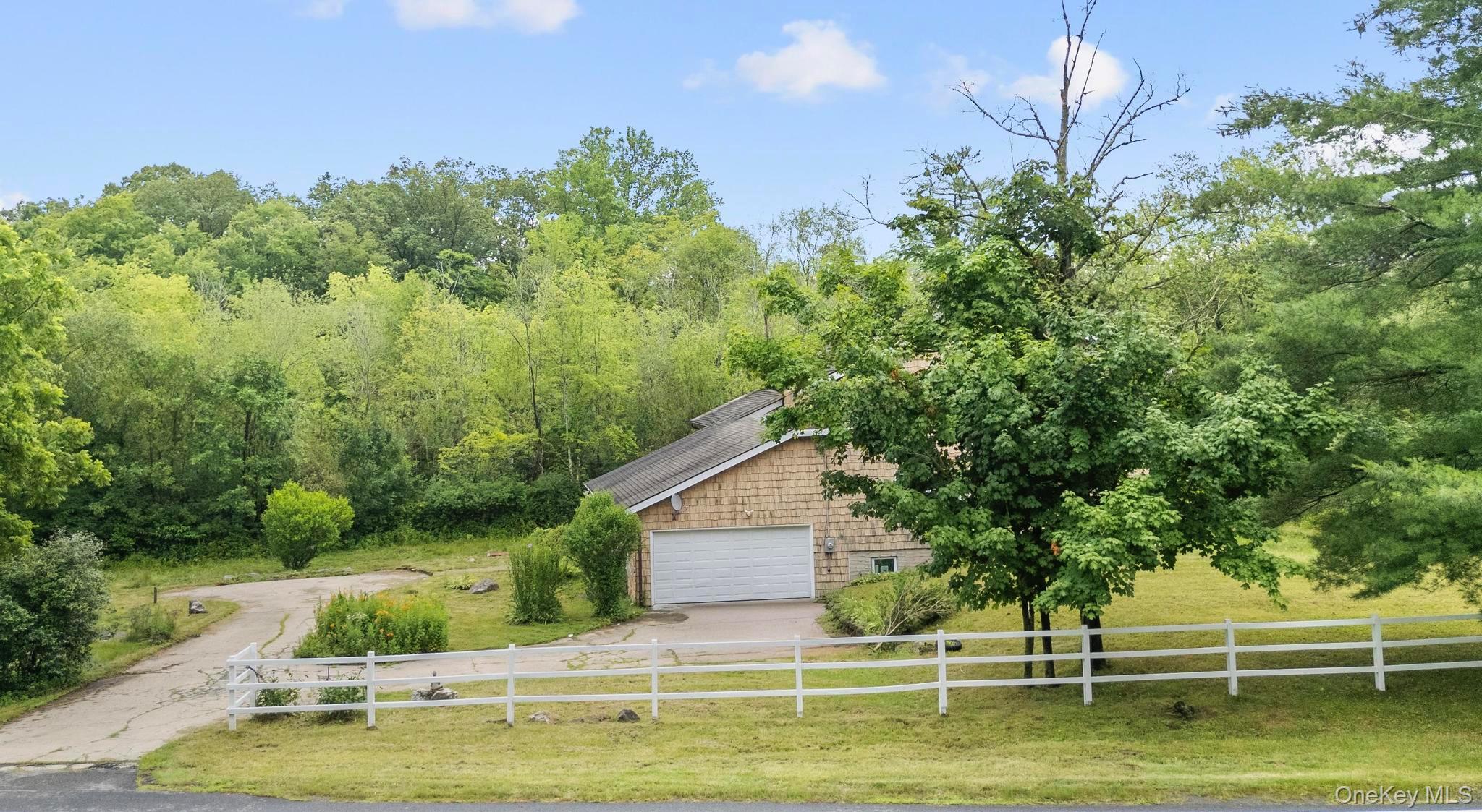 513 Bedford Road Armonk, NY 10504 - Photo 31 of 38 a view of a house with pool