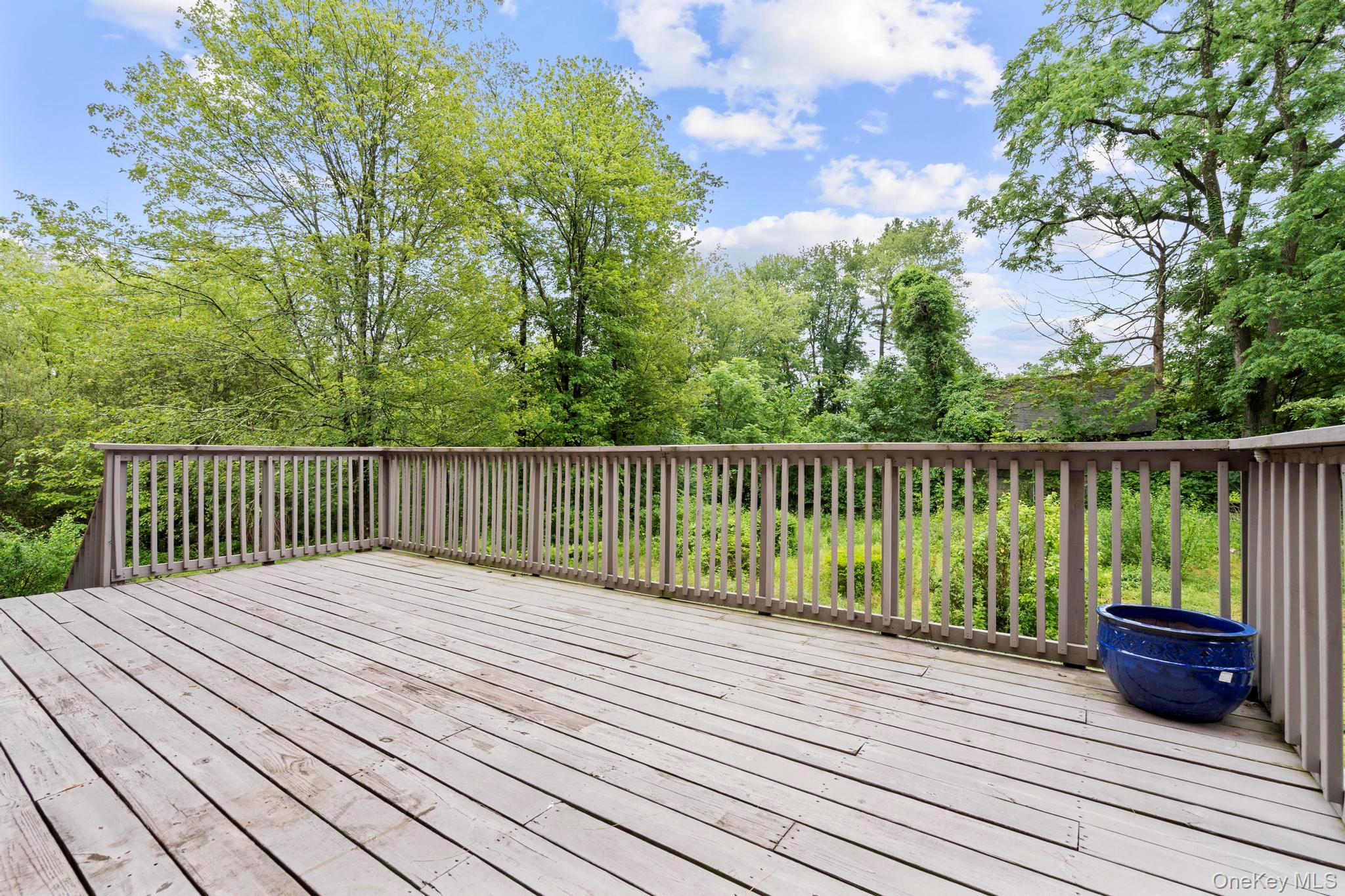 513 Bedford Road Armonk, NY 10504 - Photo 32 of 38 a view of balcony with wooden floor and fence