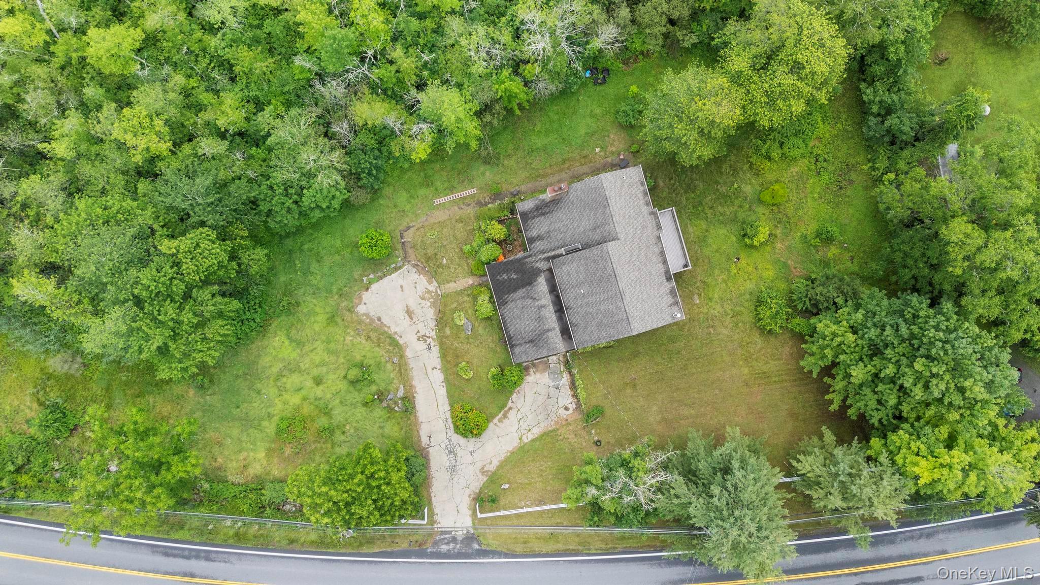 513 Bedford Road Armonk, NY 10504 - Photo 33 of 38 an aerial view of a house with a yard basket ball court and outdoor seating