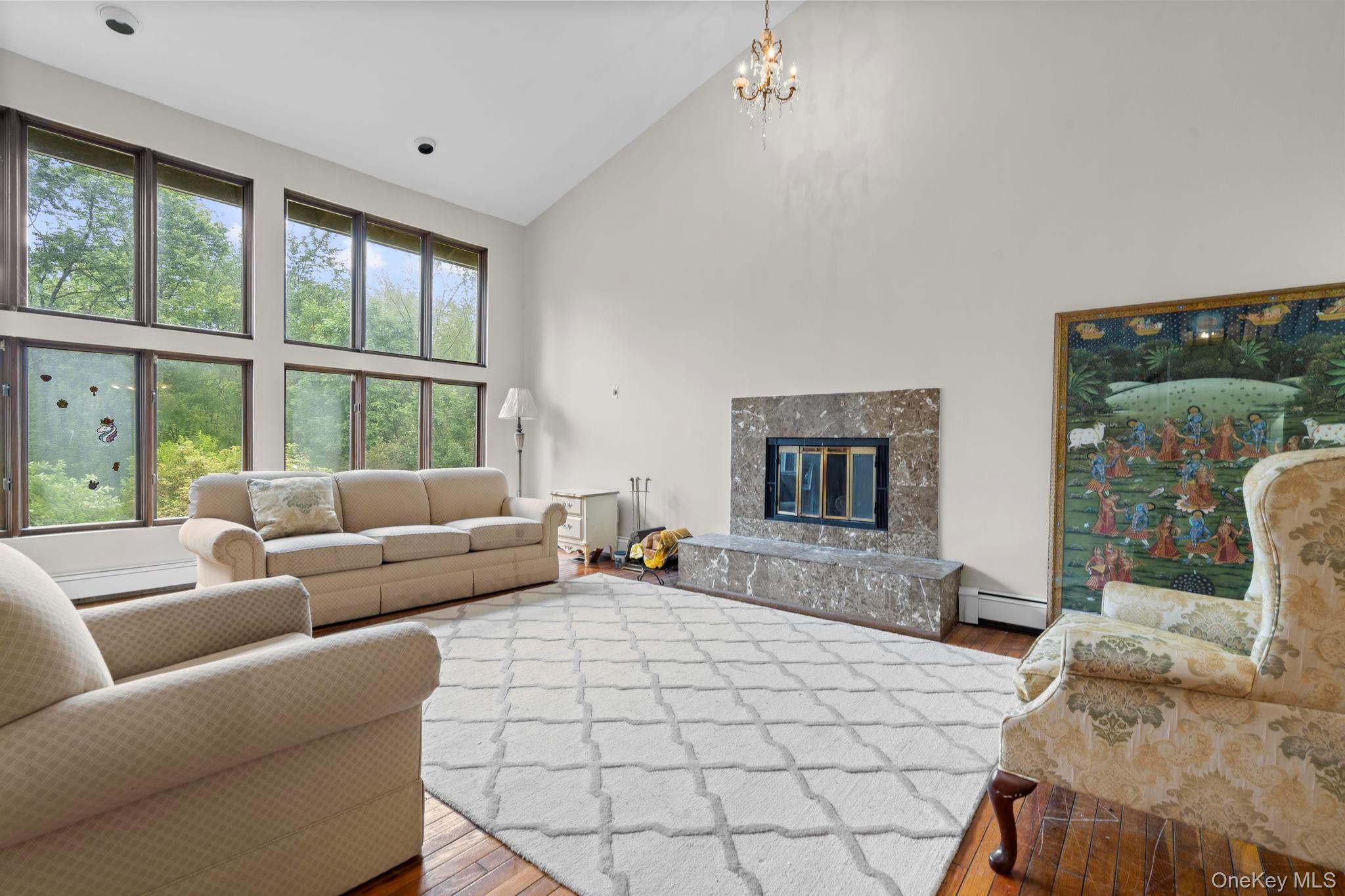 513 Bedford Road Armonk, NY 10504 - Photo 4 of 38 a bedroom with furniture and a large window