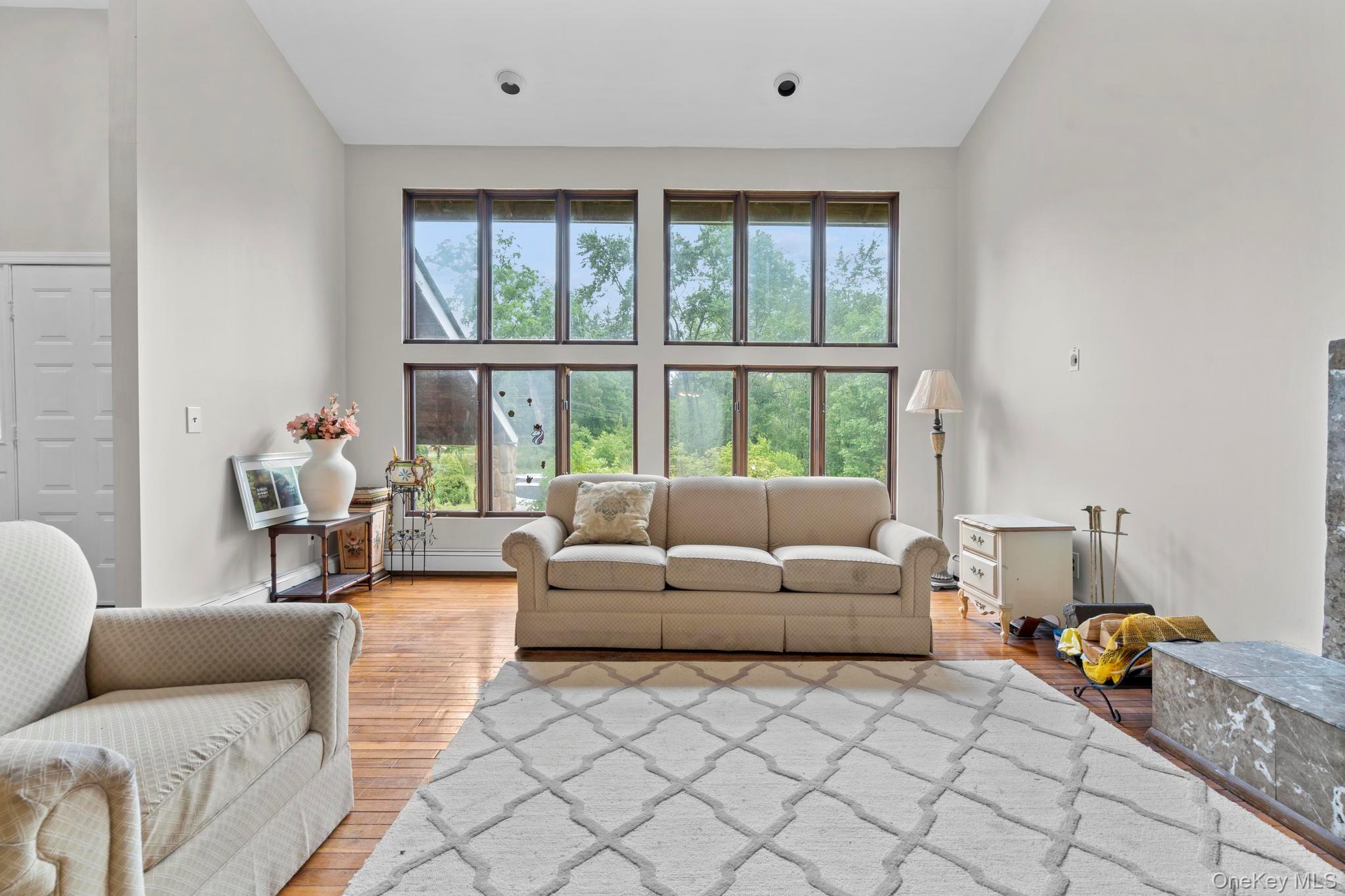 513 Bedford Road Armonk, NY 10504 - Photo 6 of 38 a living room with furniture and a large window