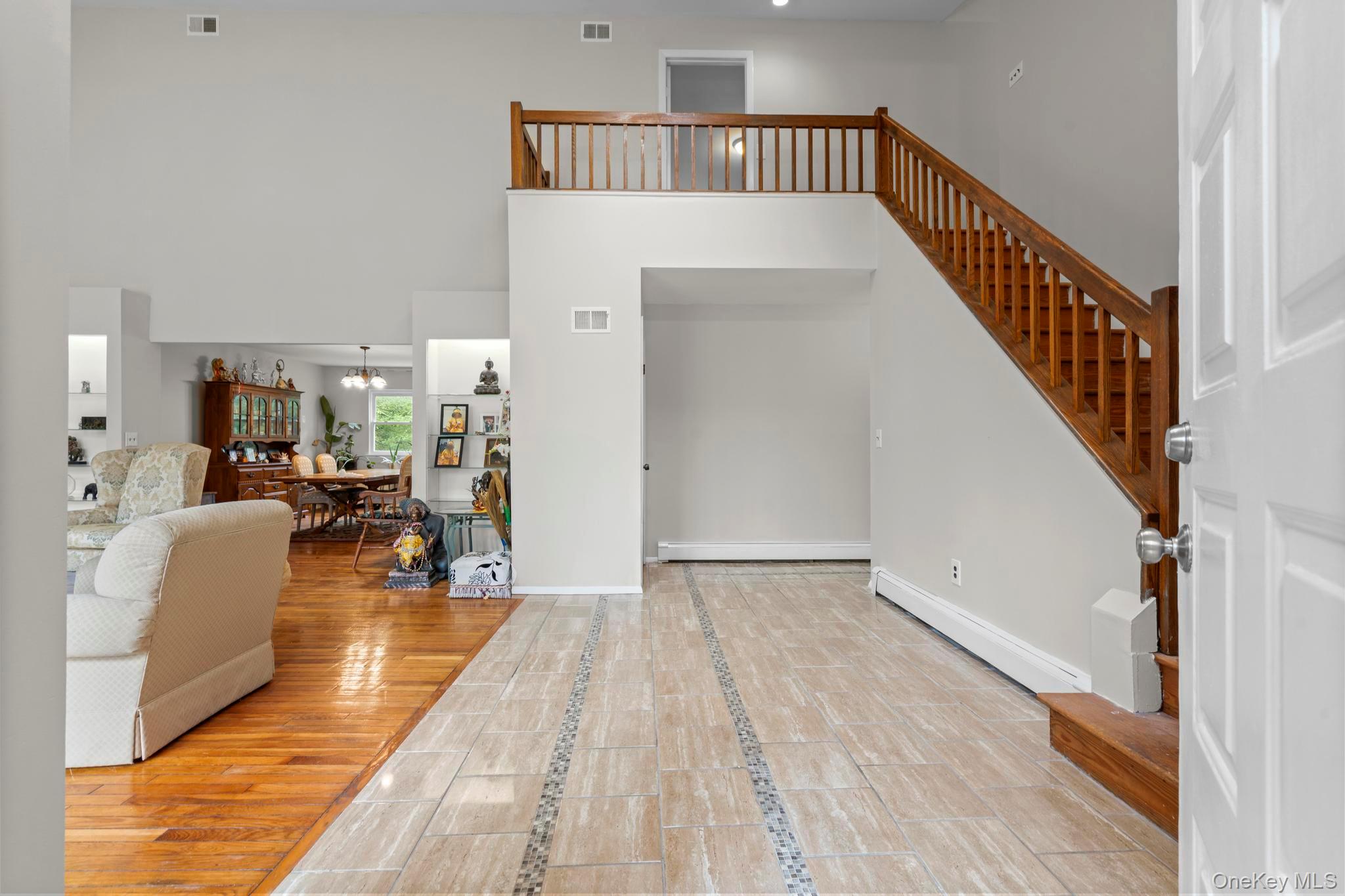 513 Bedford Road Armonk, NY 10504 - Photo 8 of 38 a view of a living room and a livingroom with furniture stairs