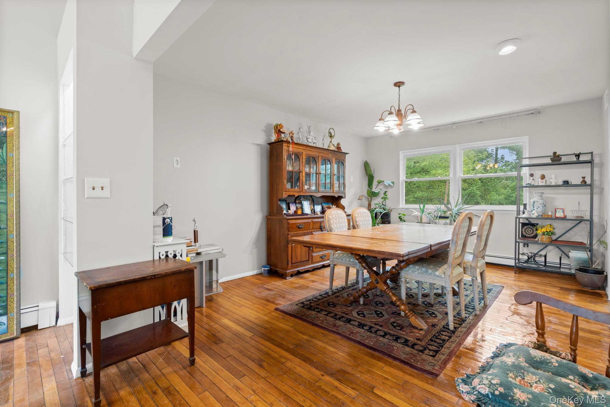 513 Bedford Road Armonk, NY 10504 - Photo 9 of 38 a dining room with furniture a rug and wooden floor