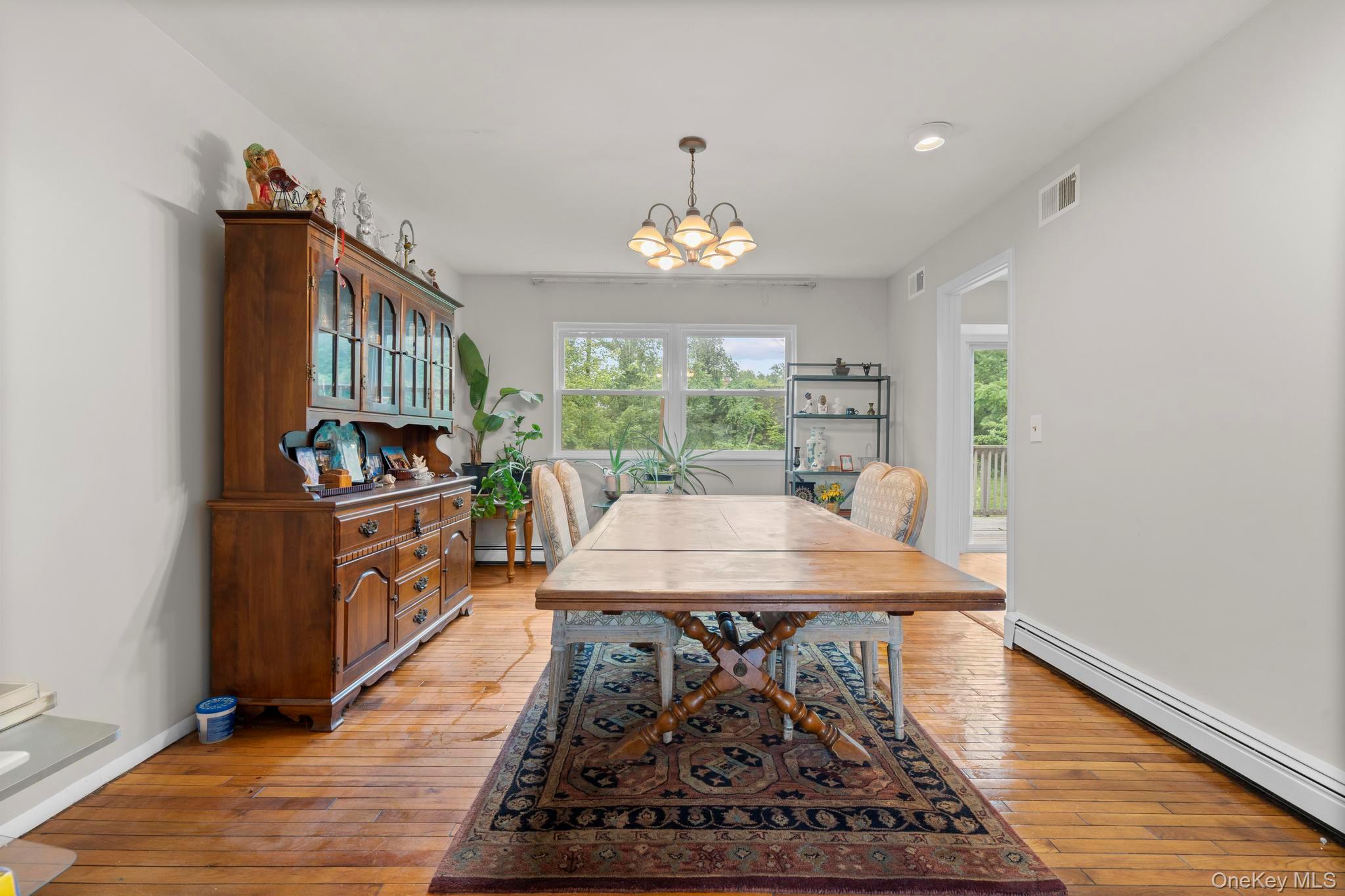 513 Bedford Road Armonk, NY 10504 - Photo 10 of 38 a view of a dining room with furniture window and wooden floor