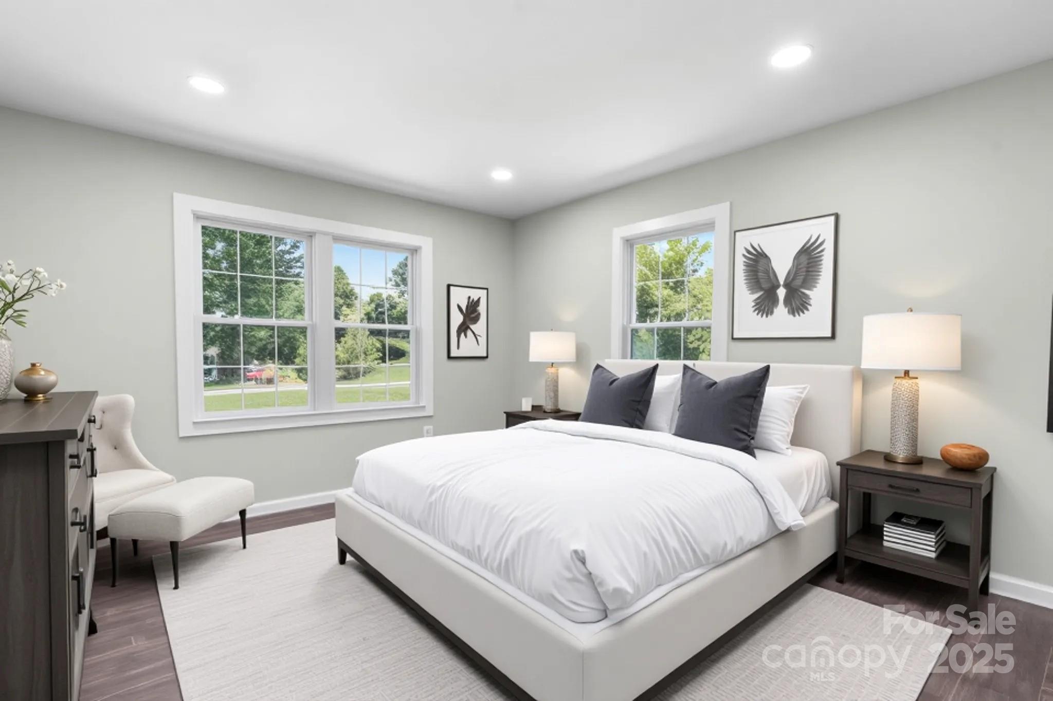 191 Harmony Grove Road Nebo, NC 28761 - Photo 22 of 47 a bedroom with a bed and wooden floor