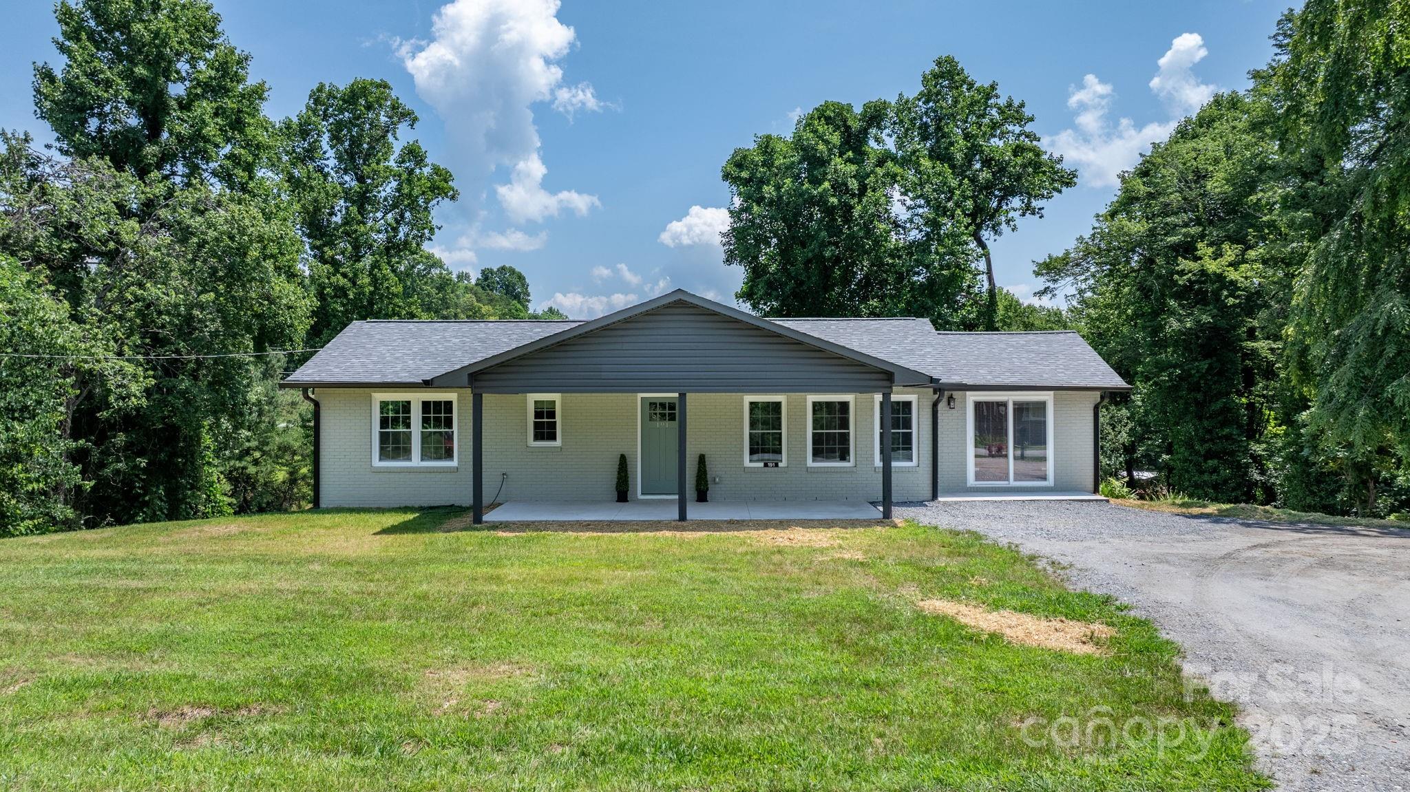191 Harmony Grove Road Nebo, NC 28761 - Photo 35 of 47 a house with trees in the background