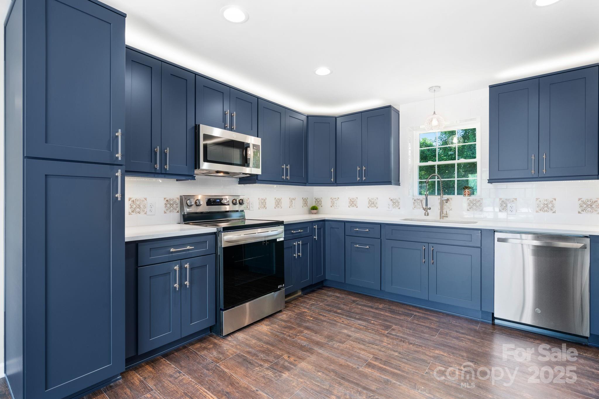 191 Harmony Grove Road Nebo, NC 28761 - Photo 38 of 47 a kitchen with a sink cabinets and window
