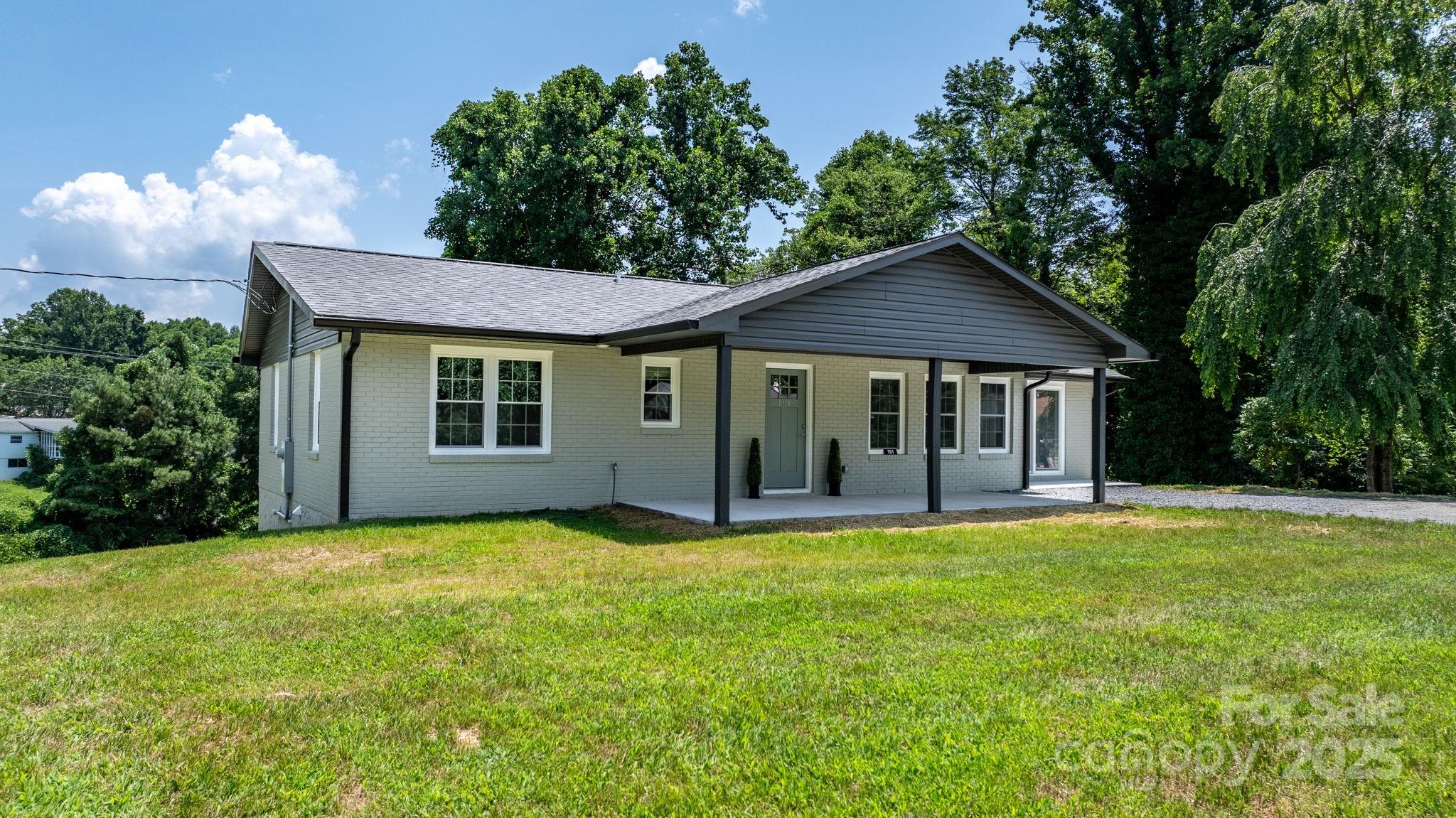 191 Harmony Grove Road Nebo, NC 28761 - Photo 43 of 47 a front view of a house with a garden