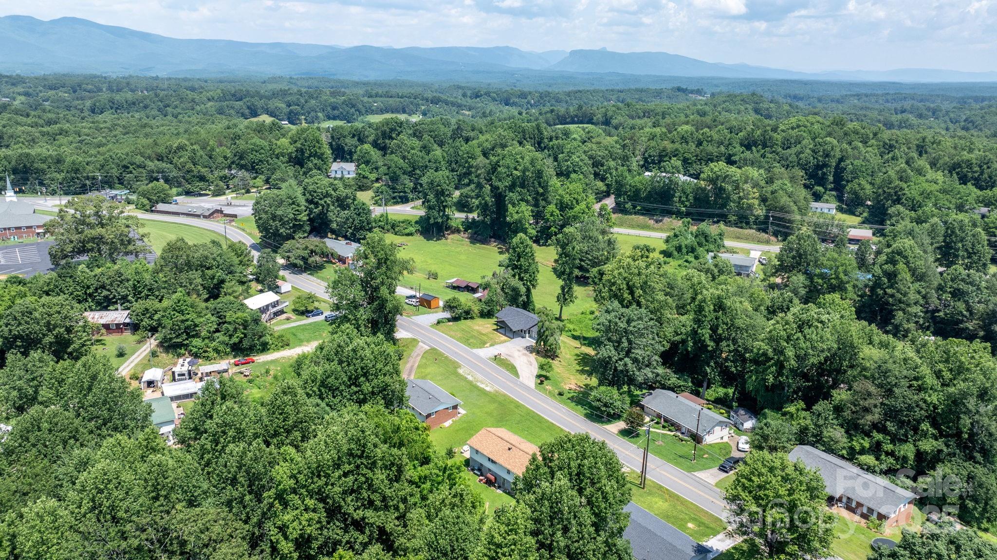 191 Harmony Grove Road Nebo, NC 28761 - Photo 46 of 47 an aerial view of residential house with outdoor space and trees all around