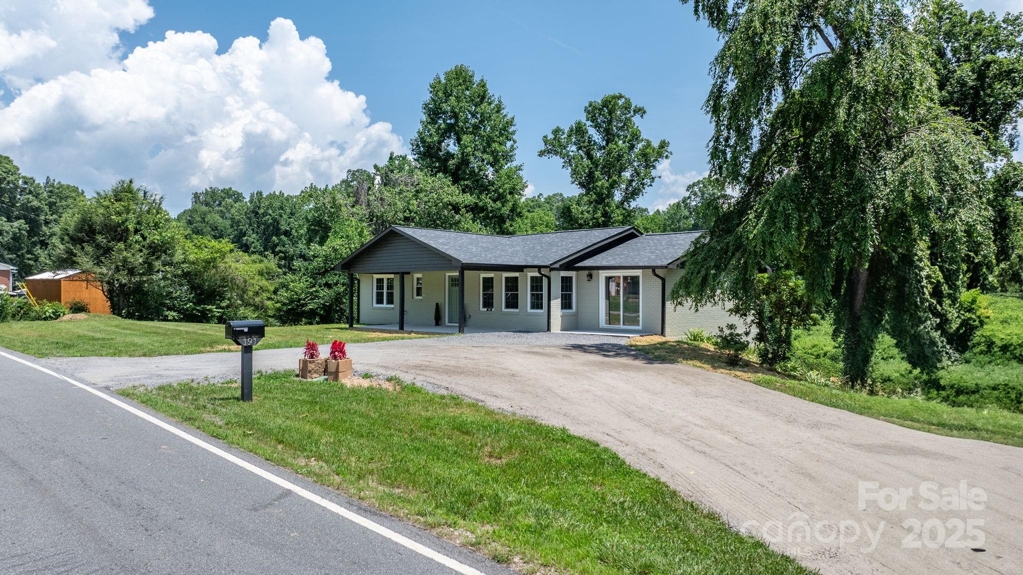 191 Harmony Grove Road Nebo, NC 28761 - Photo 8 of 47 a front view of a house with a yard