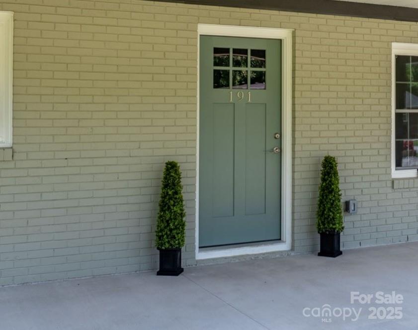 191 Harmony Grove Road Nebo, NC 28761 - Photo 9 of 47 a view of a potted plant in front of a door