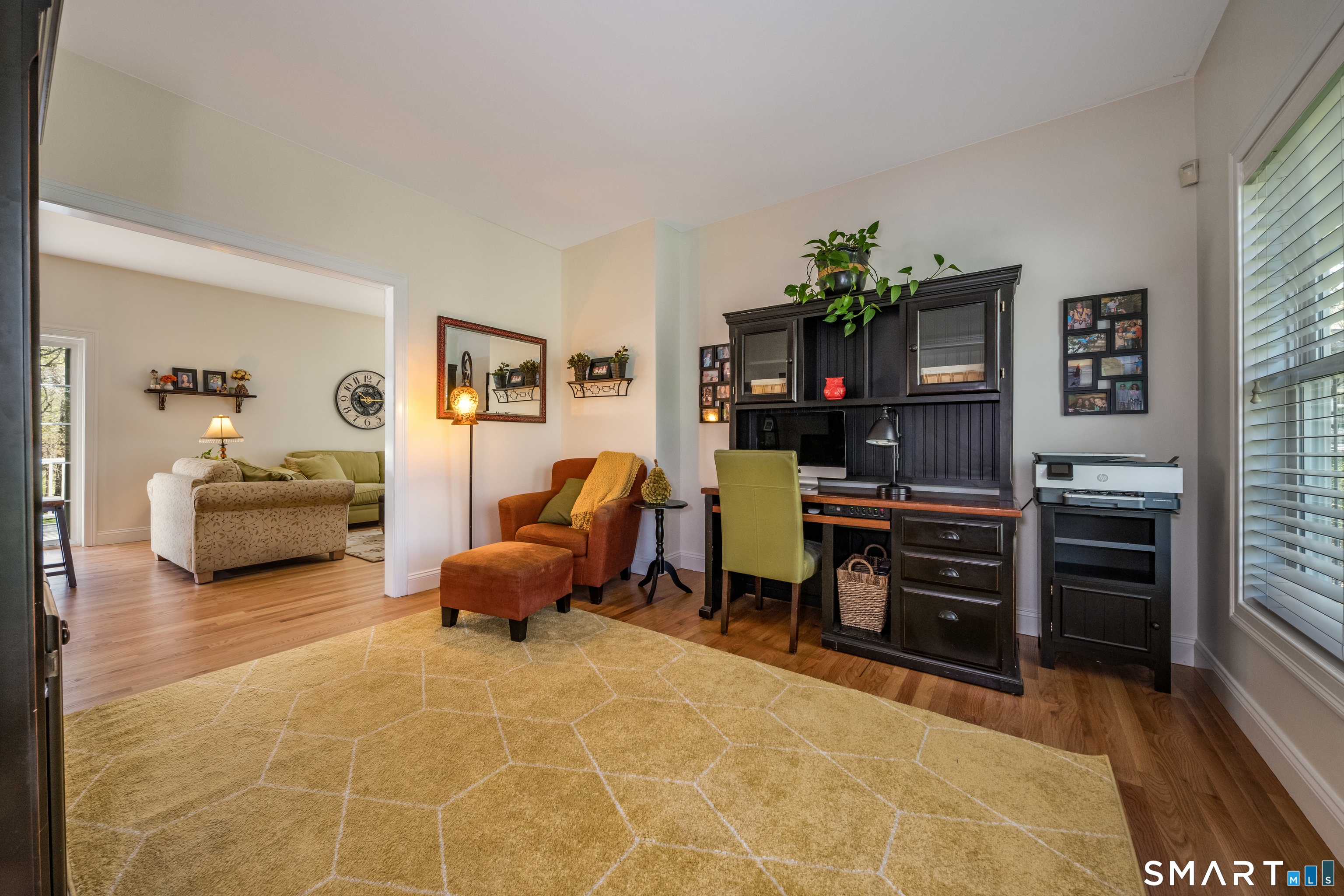 463 Tanner Marsh Road Guilford, CT 06437 - Photo 13 of 40 a living room with furniture and a flat screen tv