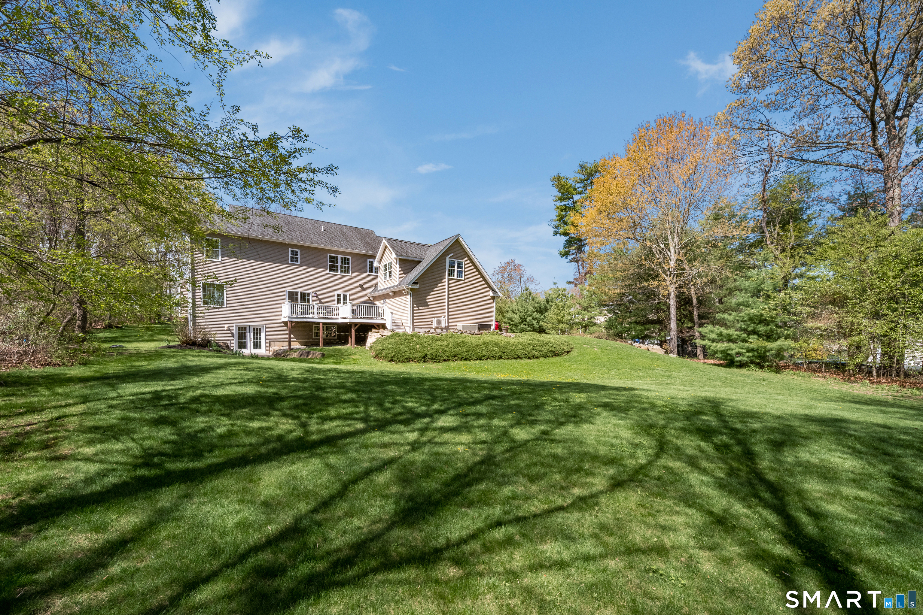 463 Tanner Marsh Road Guilford, CT 06437 - Photo 34 of 40 a view of a house with a big yard and large trees