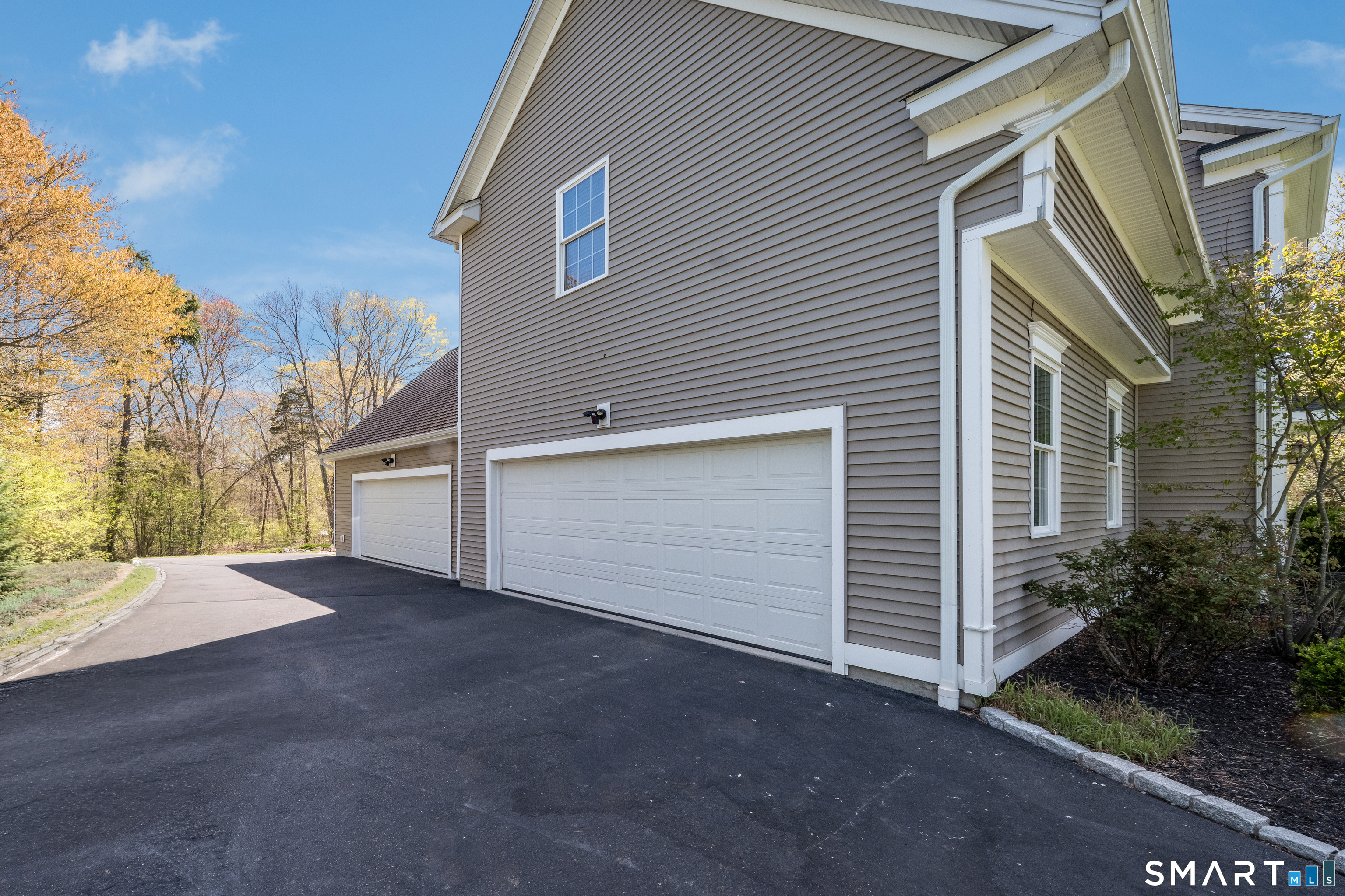 463 Tanner Marsh Road Guilford, CT 06437 - Photo 37 of 40 a view of a house with a yard and garage