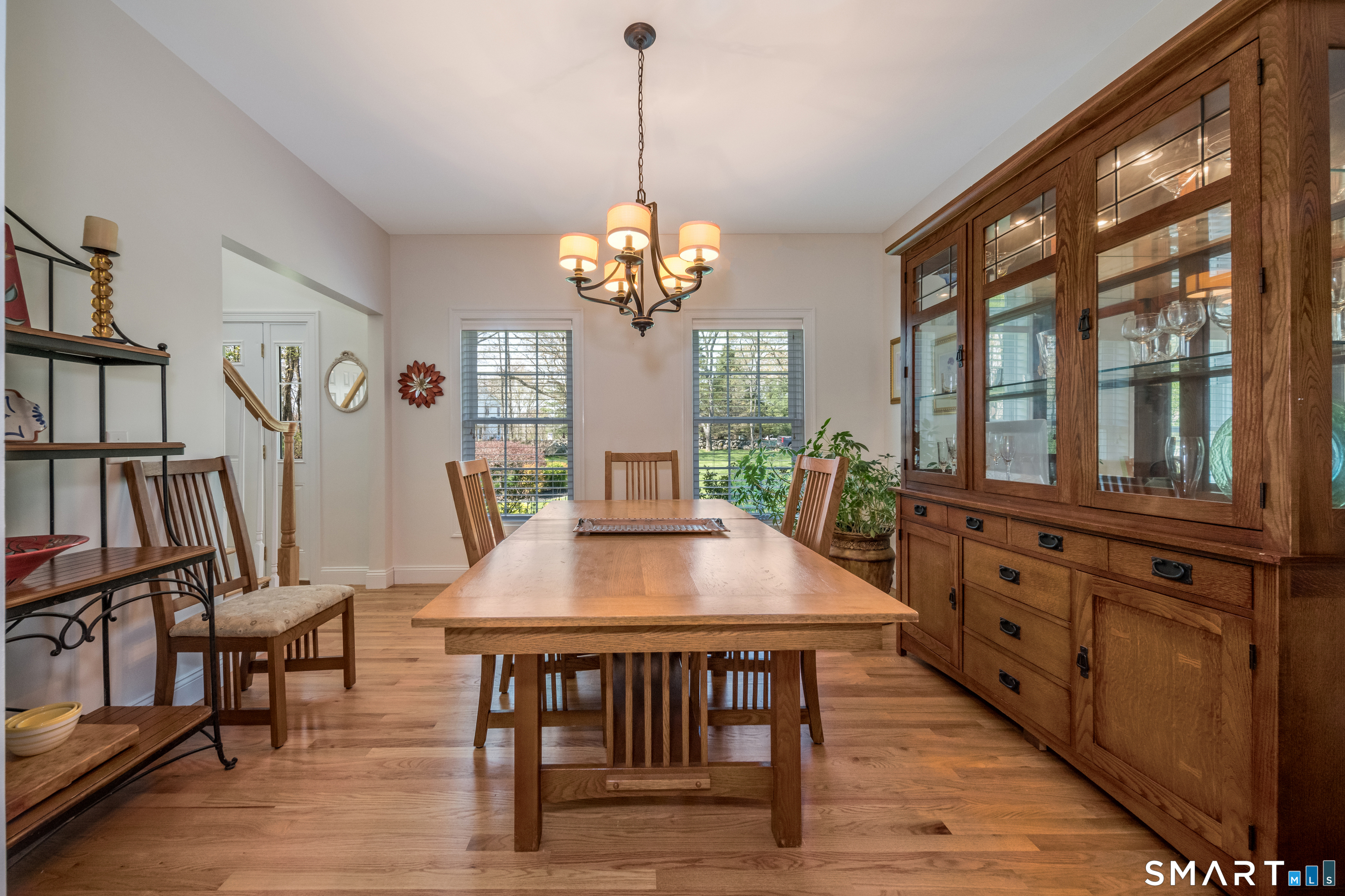 463 Tanner Marsh Road Guilford, CT 06437 - Photo 10 of 40 a view of a dining room with furniture window and wooden floor