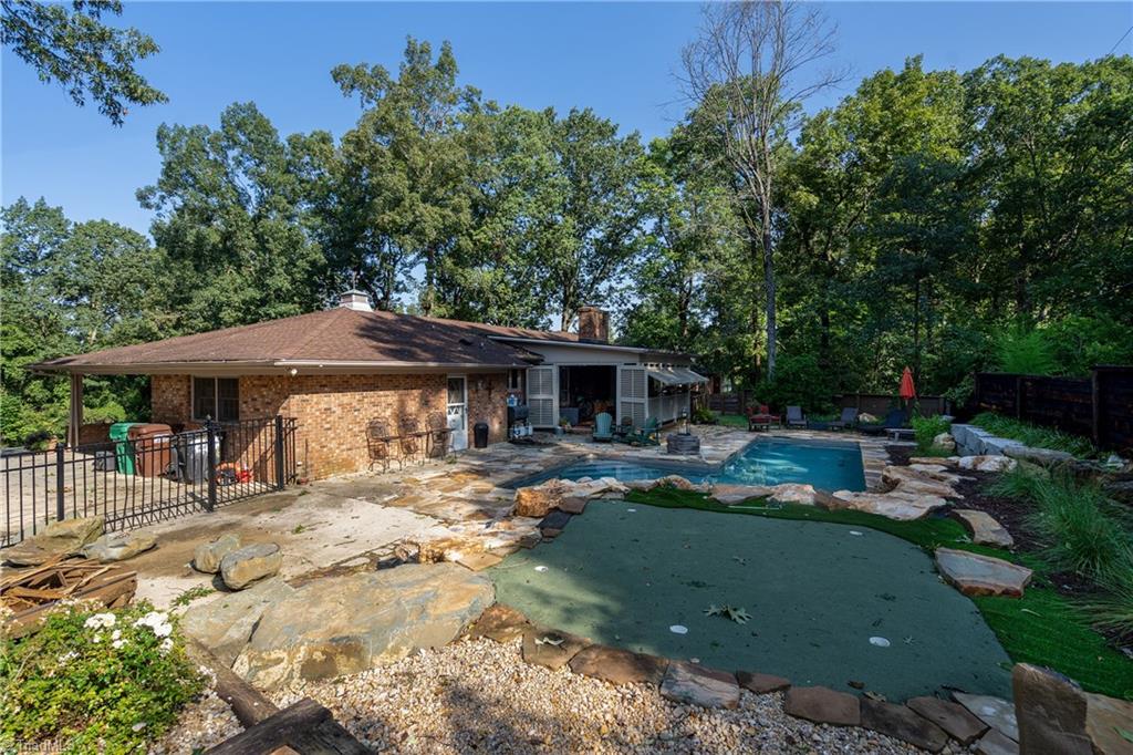 926 Croyden Street High Point, NC 27262 - Photo 2 of 23 Back Yard with Putting Green and Pool.