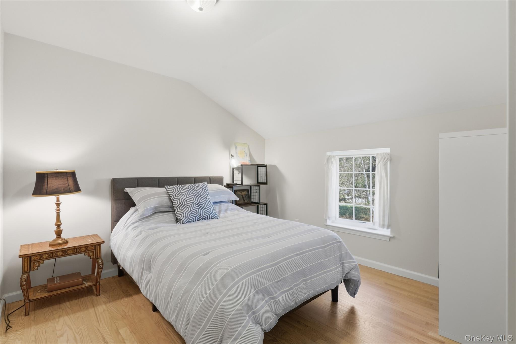 1 Lira Street Wallkill, NY 12589 - Photo 19 of 31 a bedroom with a bed and a lamp