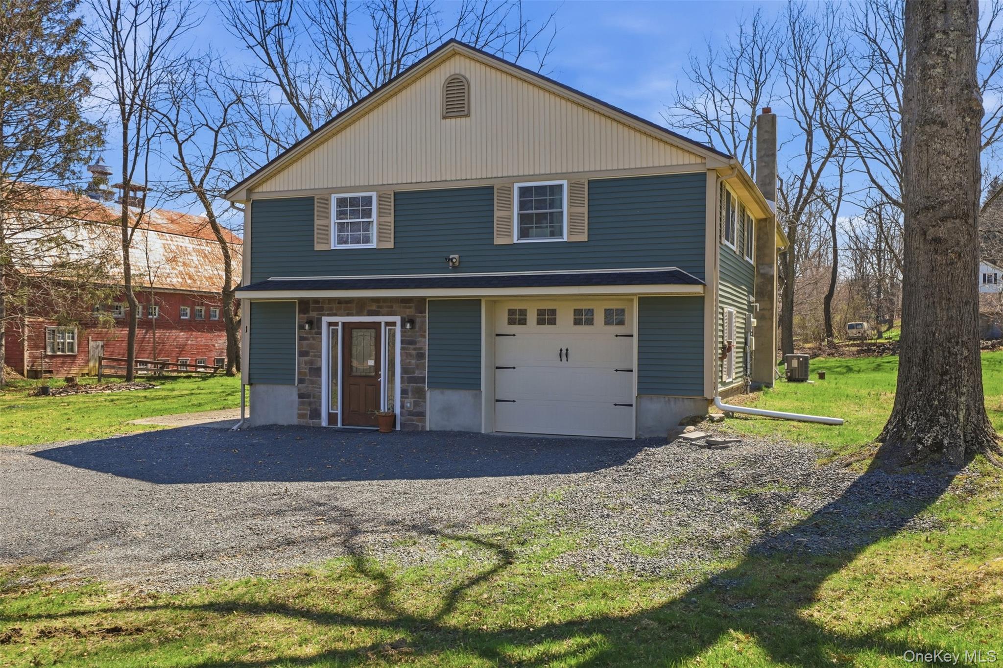 1 Lira Street Wallkill, NY 12589 - Photo 2 of 31 a front view of a house with a yard and garage