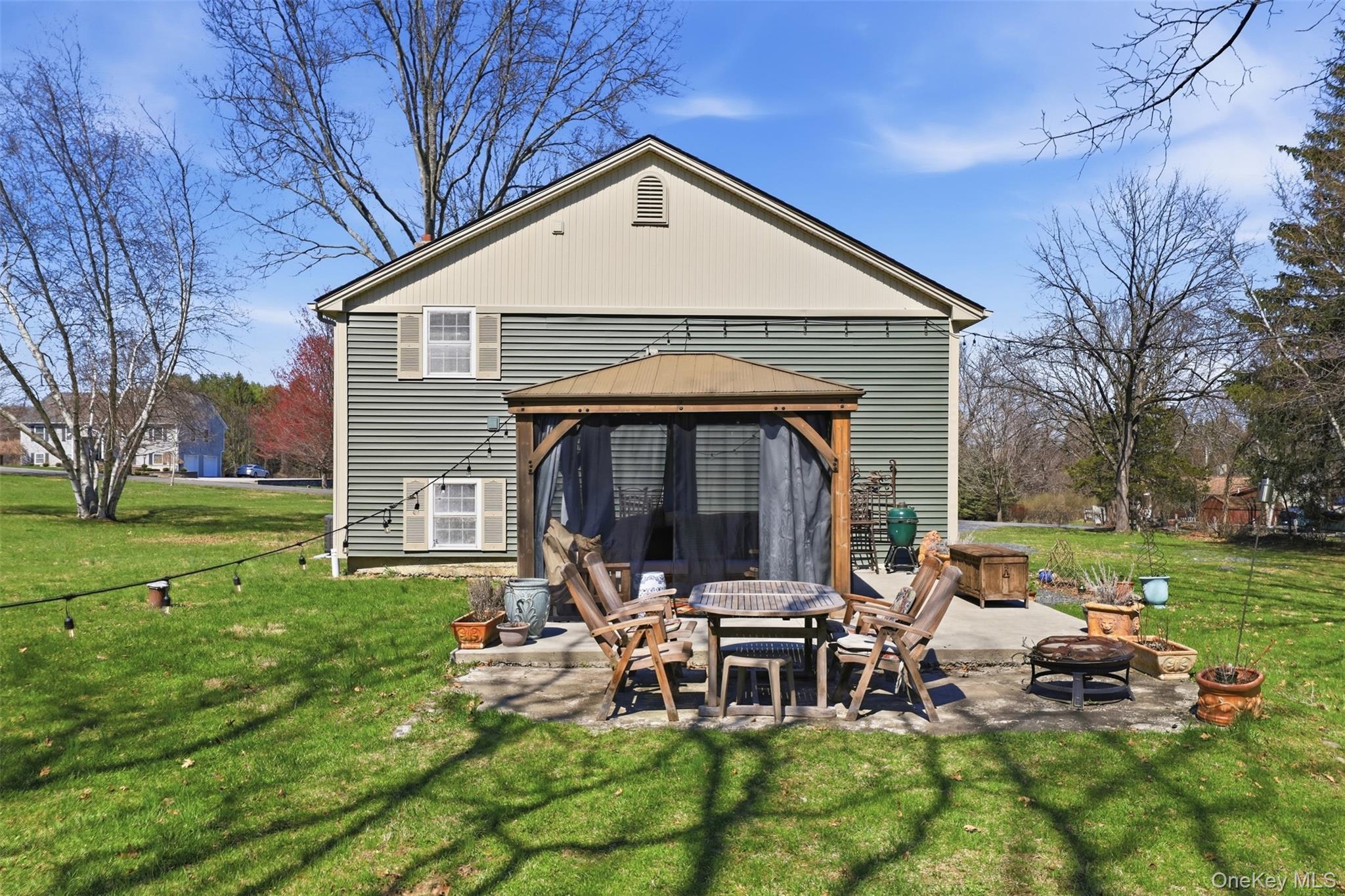 1 Lira Street Wallkill, NY 12589 - Photo 26 of 31 a backyard of a house with table and chairs