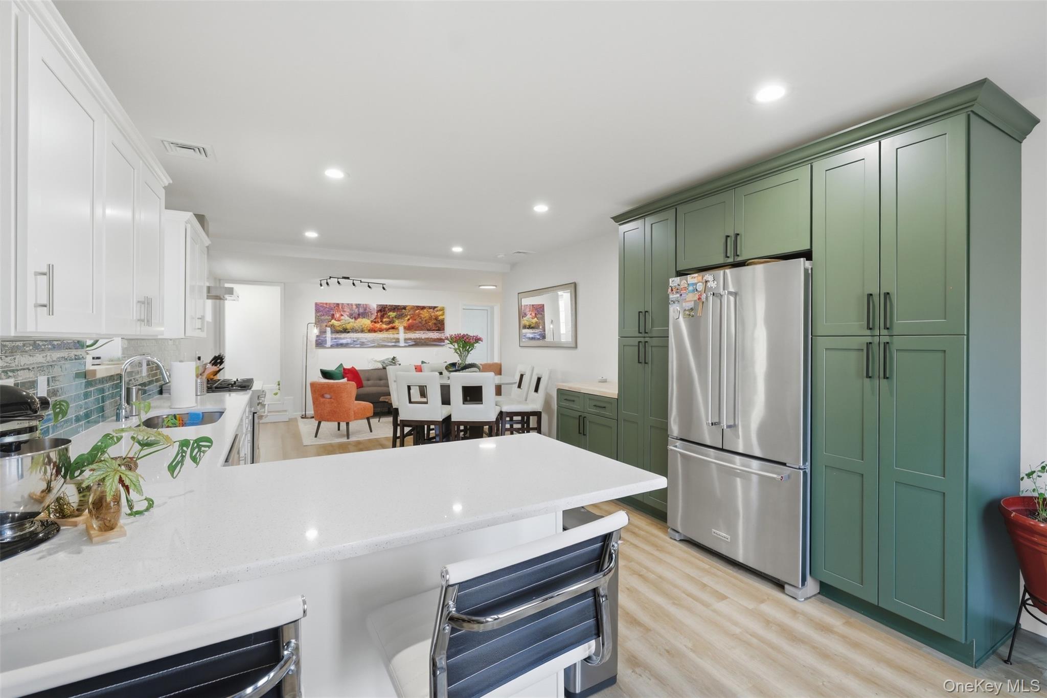 1 Lira Street Wallkill, NY 12589 - Photo 9 of 31 a kitchen with stainless steel appliances a refrigerator and a wooden floor