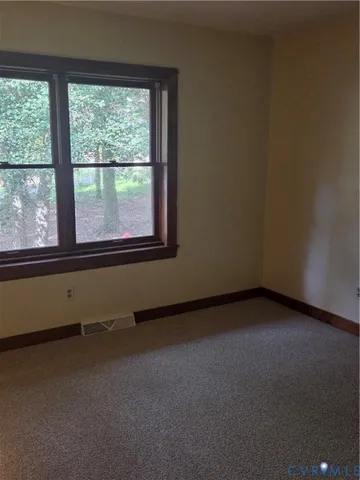 a view of a room that has a window in it