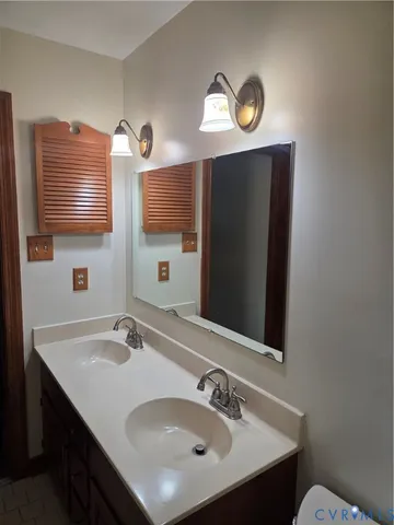a room with linen closet and wooden floor