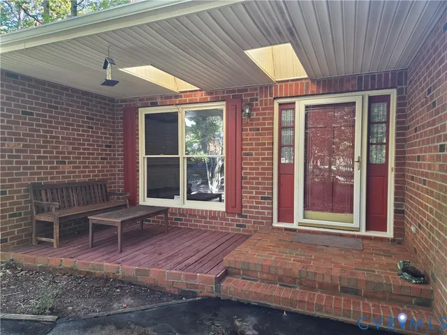 a front view of a house with a lounge chair