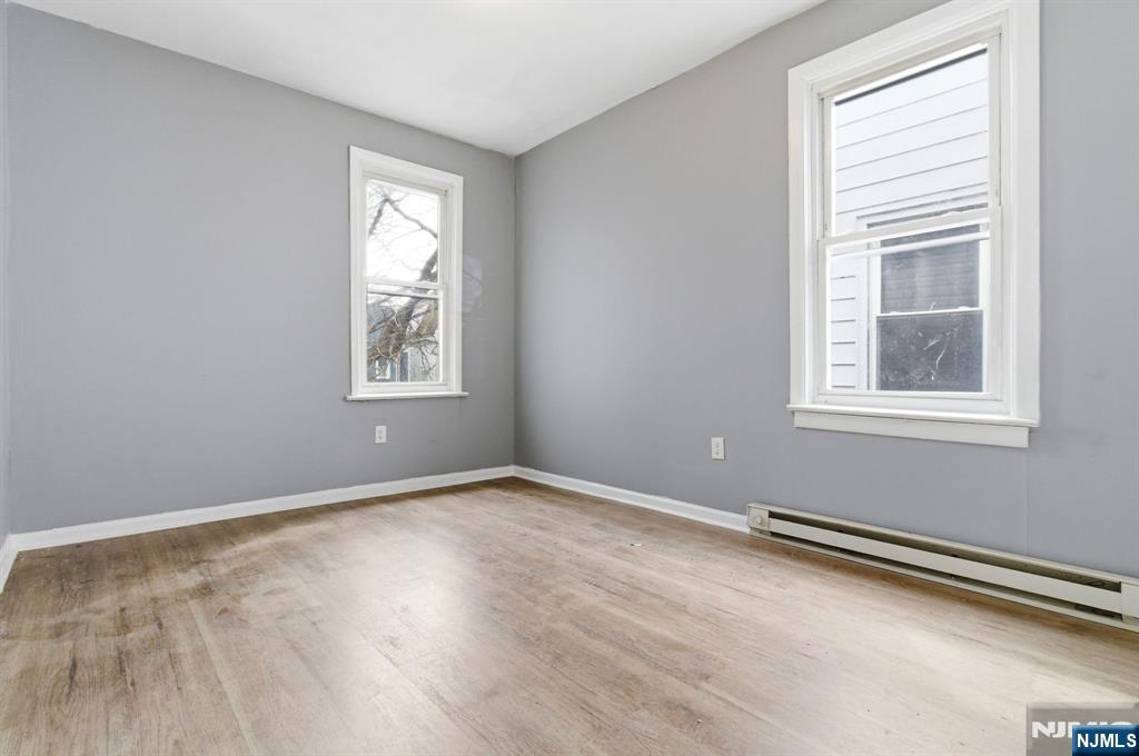 76 Grace Street Irvington, NJ 07111 - Photo 14 of 20 an empty room with windows