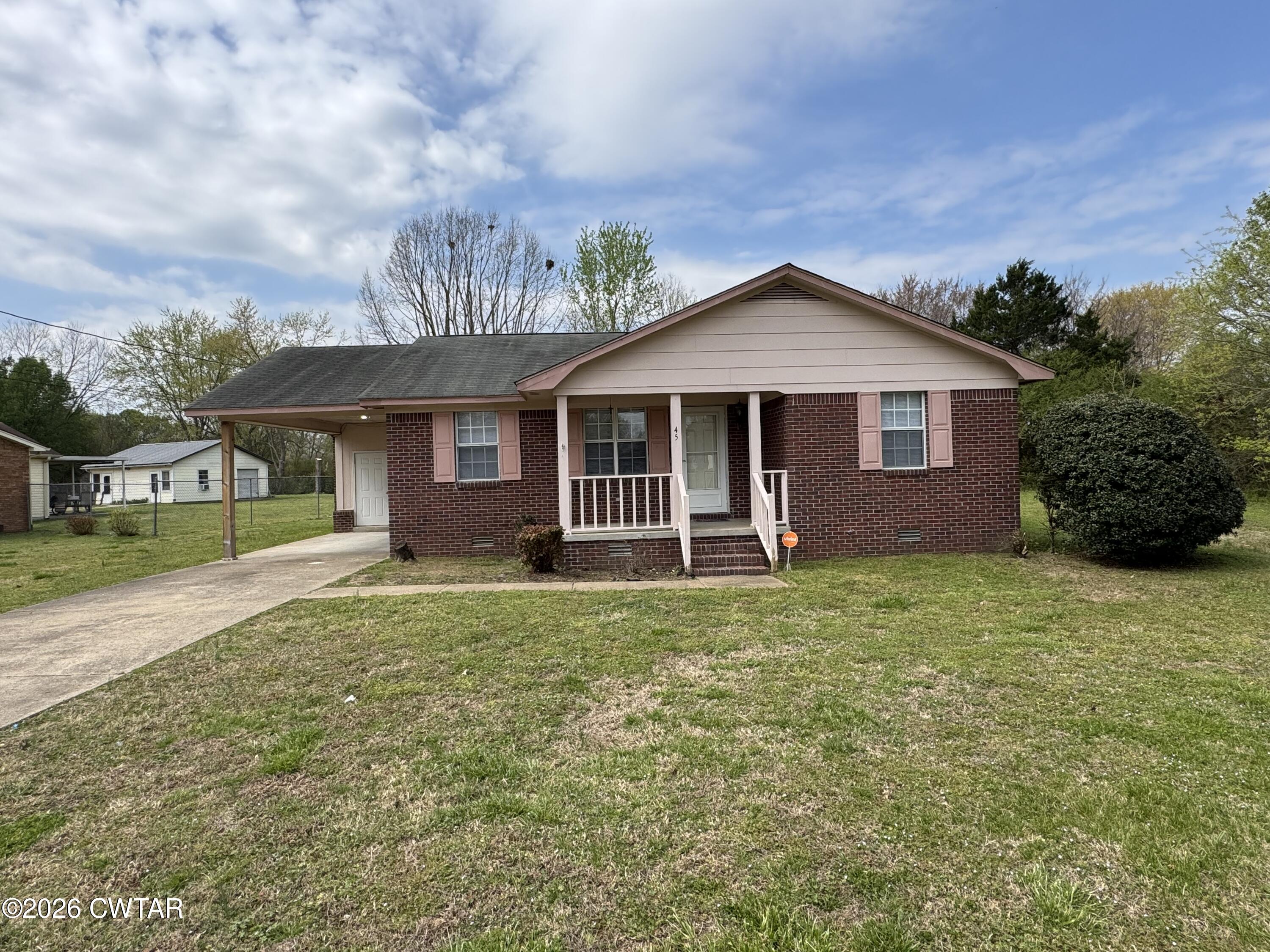 45 Ellendale Cove Jackson, TN 38305 - Photo 1 of 22 a view of a house with a yard and plants