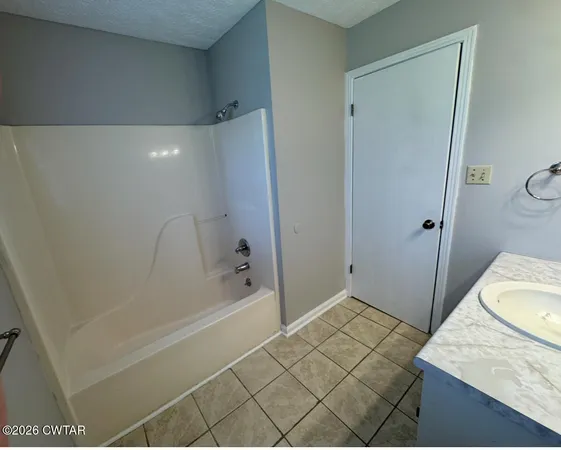 a bathroom with a sink and a shower