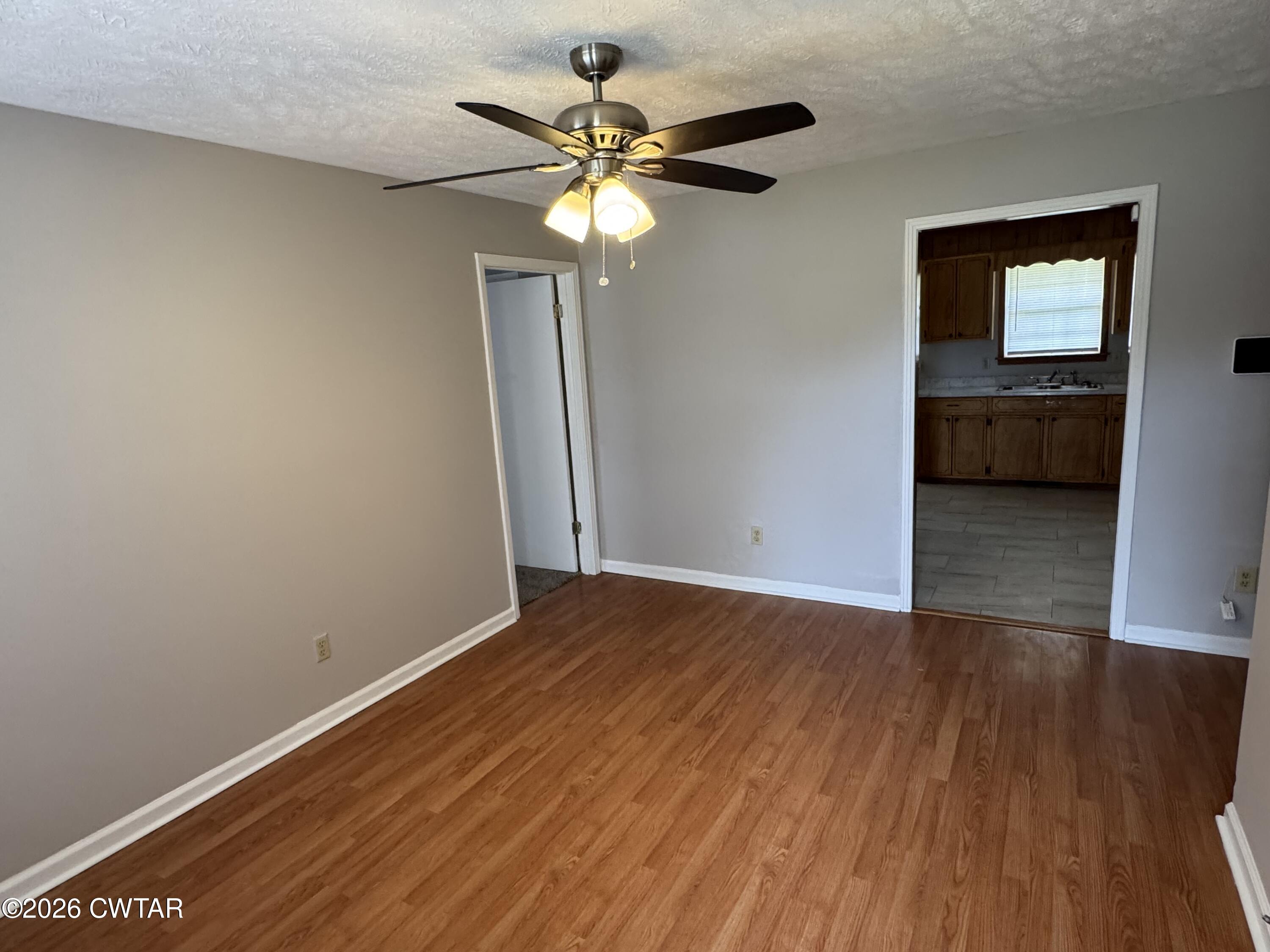 45 Ellendale Cove Jackson, TN 38305 - Photo 3 of 22 a view of empty room with wooden floor