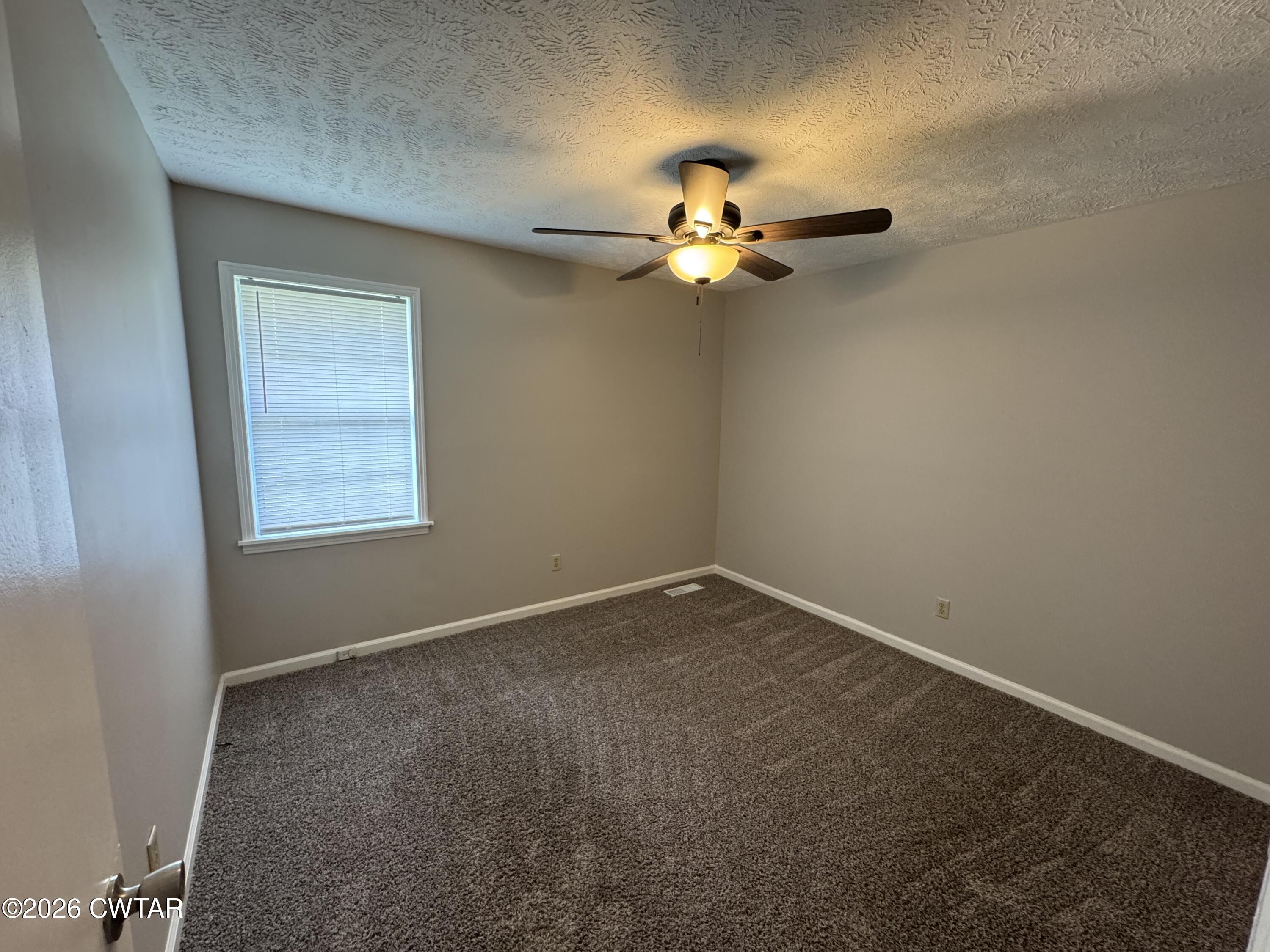 45 Ellendale Cove Jackson, TN 38305 - Photo 9 of 22 an empty room with a window