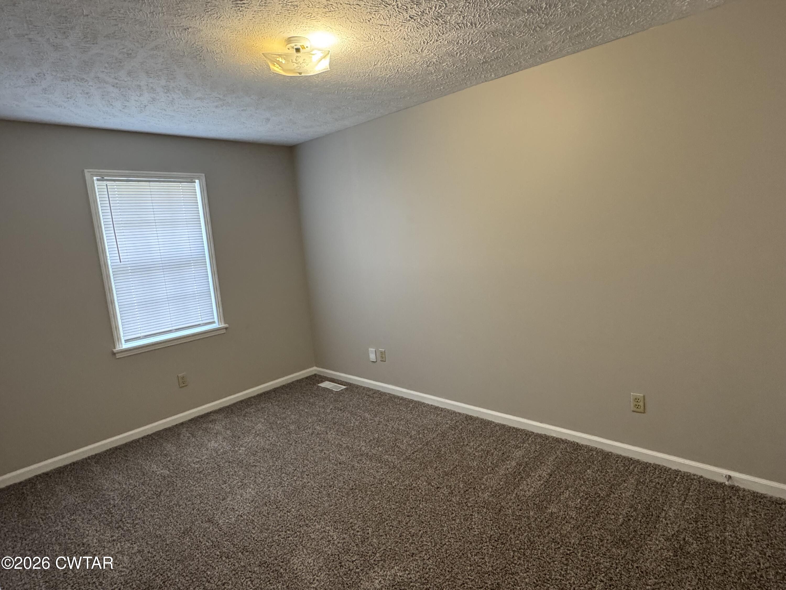 45 Ellendale Cove Jackson, TN 38305 - Photo 10 of 22 an empty room with a window