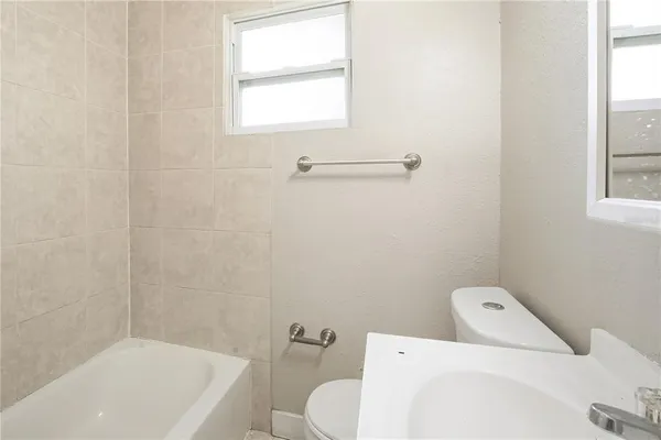 a bathroom with a toilet and a sink