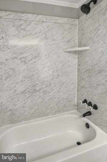 636 Portland Street Baltimore, MD 21230 - Photo 14 of 15 a bathroom with a bathtub