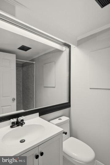 636 Portland Street Baltimore, MD 21230 - Photo 15 of 15 a bathroom with a sink a toilet and mirror