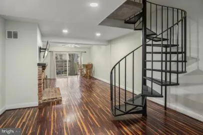 a view of entryway with wooden floor
