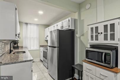636 Portland Street Baltimore, MD 21230 - Photo 6 of 15 a kitchen with a refrigerator sink and microwave