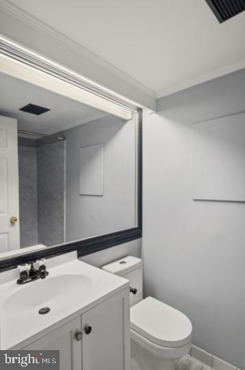 636 Portland Street Baltimore, MD 21230 - Photo 10 of 15 a bathroom with a sink a toilet and mirror