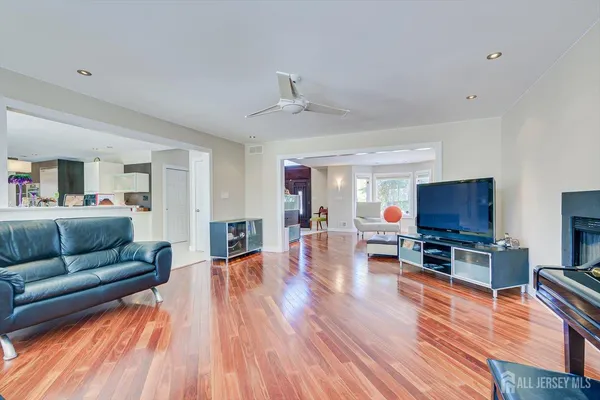 a kitchen with stainless steel appliances granite countertop a stove and a refrigerator