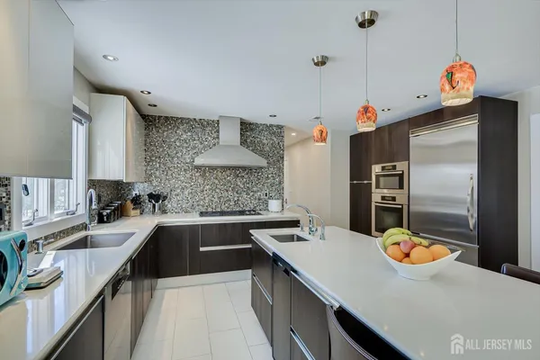 a view of a dining room with furniture wooden floor and chandelier