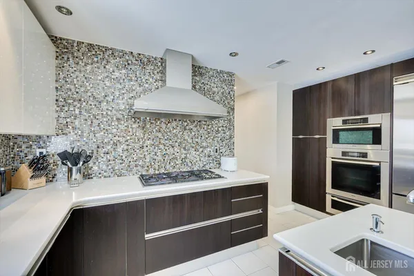 a bathroom with double sink and a mirror