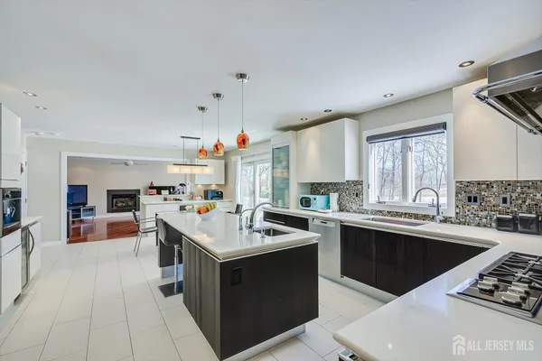 a view of a bedroom with wooden floor and windows