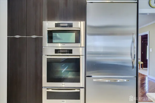 a view of a livingroom with furniture and a gym equipment