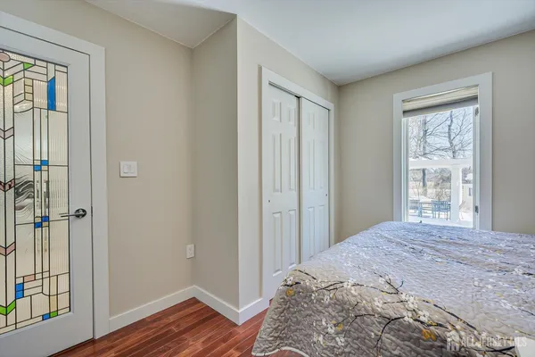 a front view of a building with snow on the road